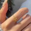 Xiaohongshu Chic Hollow Flower Bud Ring with Rhinestones - Elegant, Delicate, and Stylish Gold Accessory.
