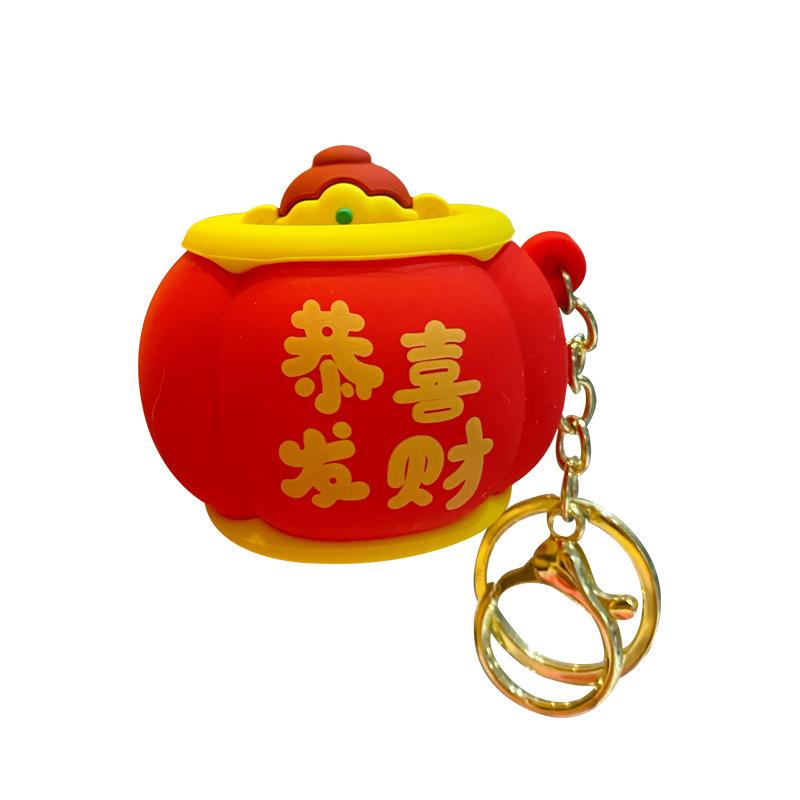 Noworoczny podskakujący Bóg Bogactwa świąteczny szczypiący muzyczny breloczek wisiorek wykwintny i uroczy męski i damski plecak szkolny breloczek do kluczy wisiorek z kółkiem
