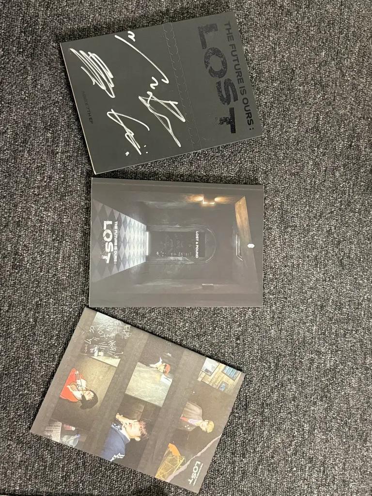 This is a sale of AB6IX's 7th EP, LOST, with handwritten signatures.