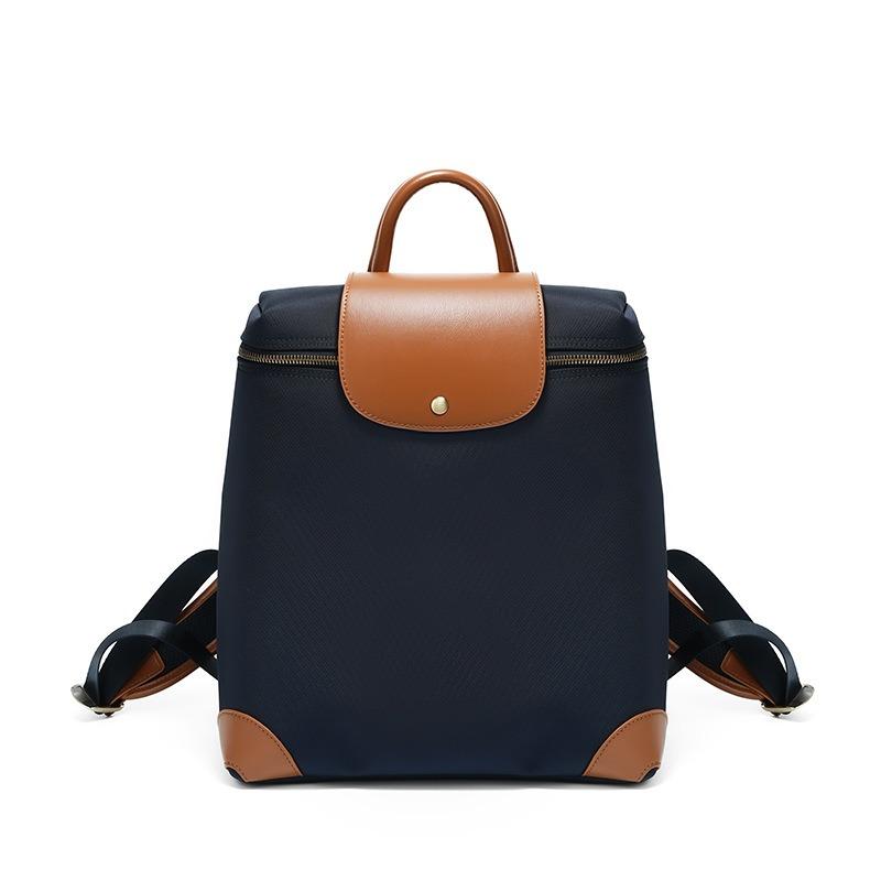 

Travel commuting simple computer bag female, large capacity lightweight nylon cloth backpack female темно-синього кольору