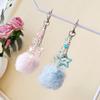 A Silvery Chain with a Large Fluffy Star-Shaped Pom-Pom and a Bow Backpack Charm, Keychain, and Phone Strap Pom-Pom Keychain