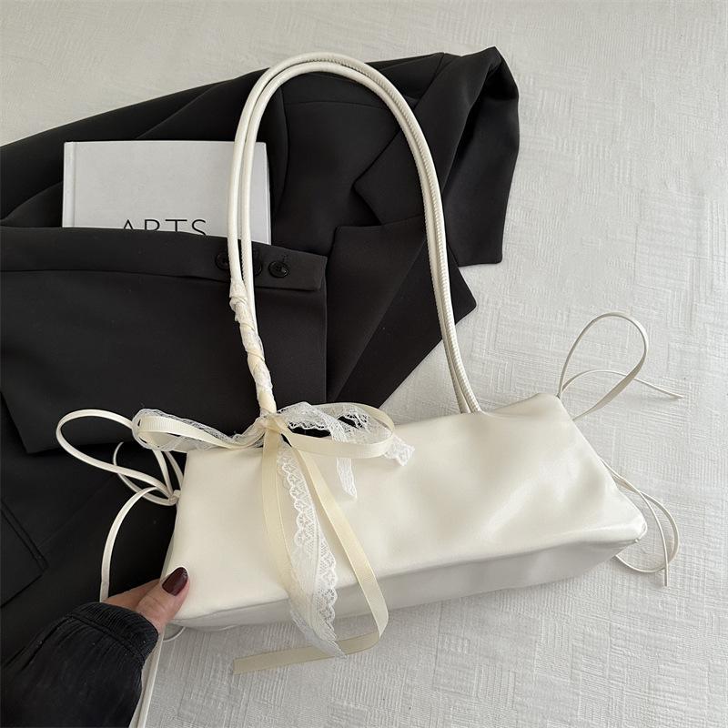 Korean version of simple ins baguette bag women's 2025 new trendy versatile commuter shoulder bag casual bow armpit bag