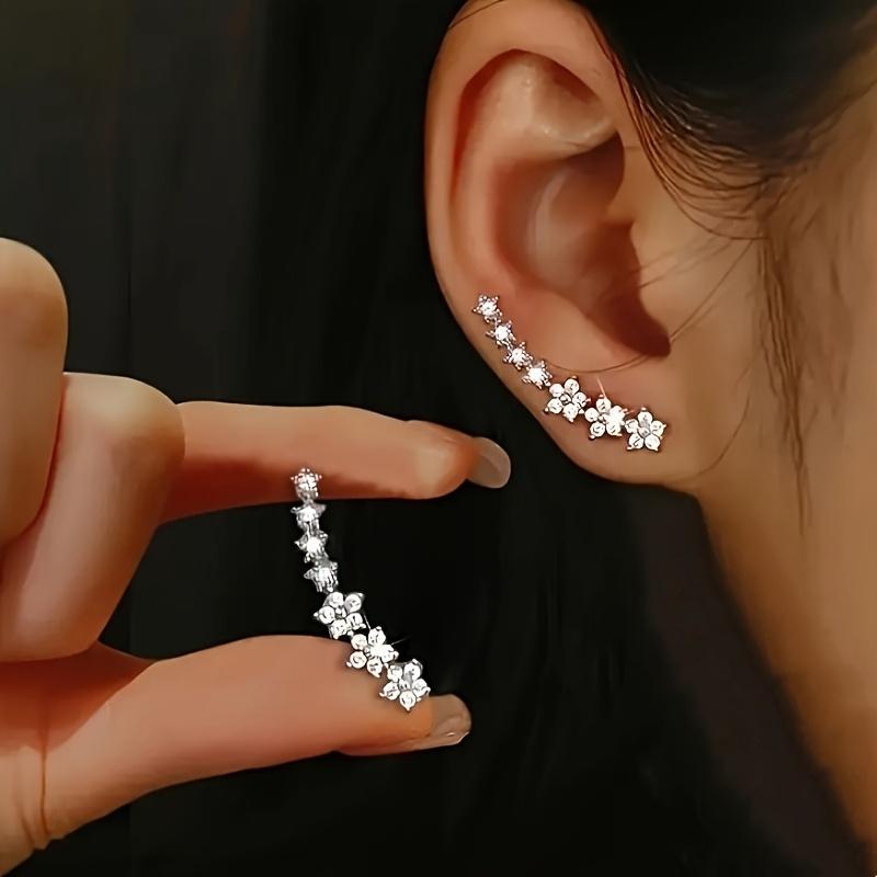 A pair of elegant and luxurious delicate floral stud earrings, fully set with diamonds and rhinestones, perfect as a Thanksgiving gift for women