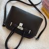 2025 new women's lychee pattern solid color lock shoulder bag temperament niche versatile commuter portable messenger