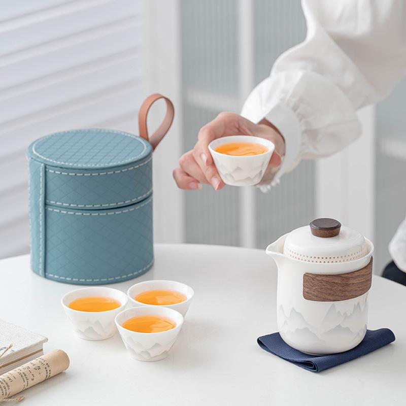 Flower travel tea set, light luxury and portable, one pot and four cups of Ru kiln car business gifts