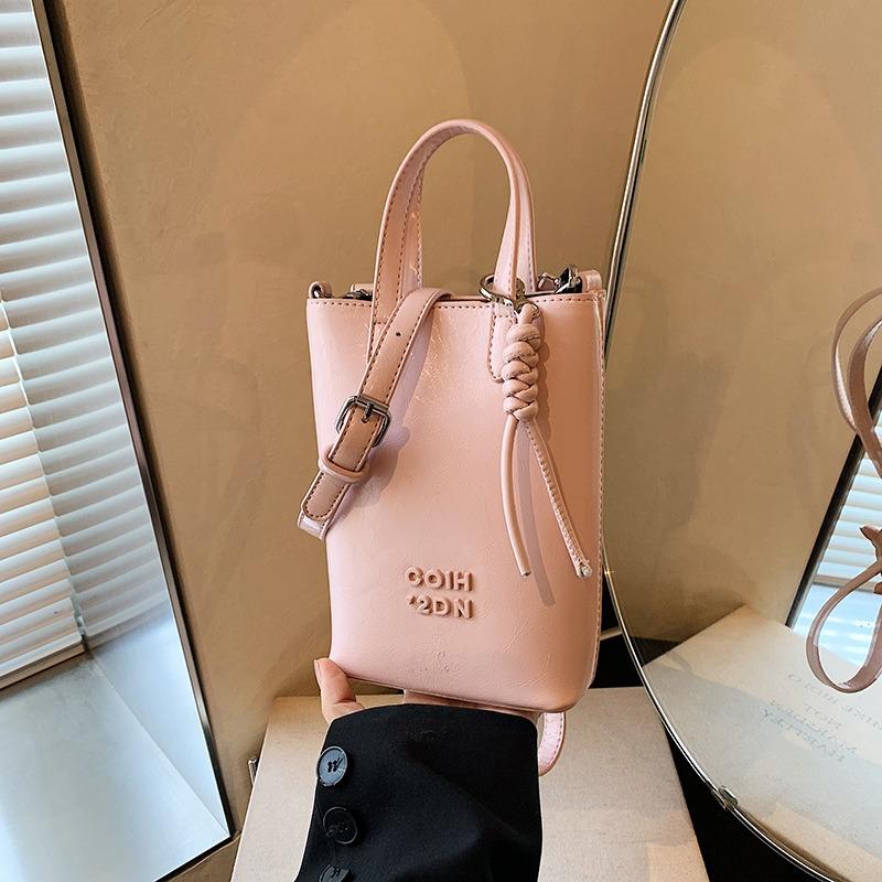 

Niche high-end hand carry leopard print bucket bag women s autumn and winter new retro fashion shoulder bag рожевий