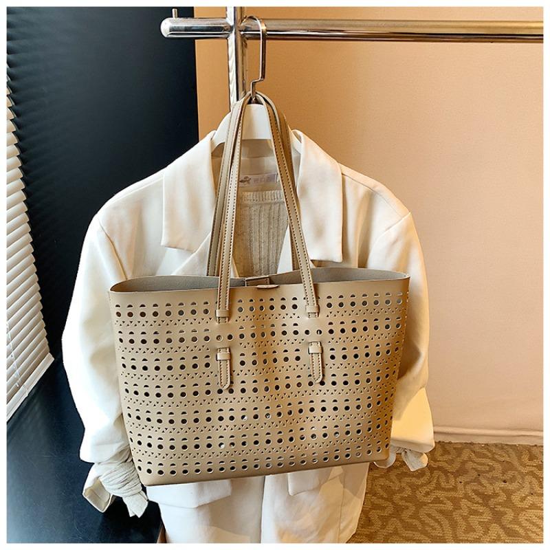 Large-capacity tote bag niche design simple hollow bag women's summer new versatile shoulder bag