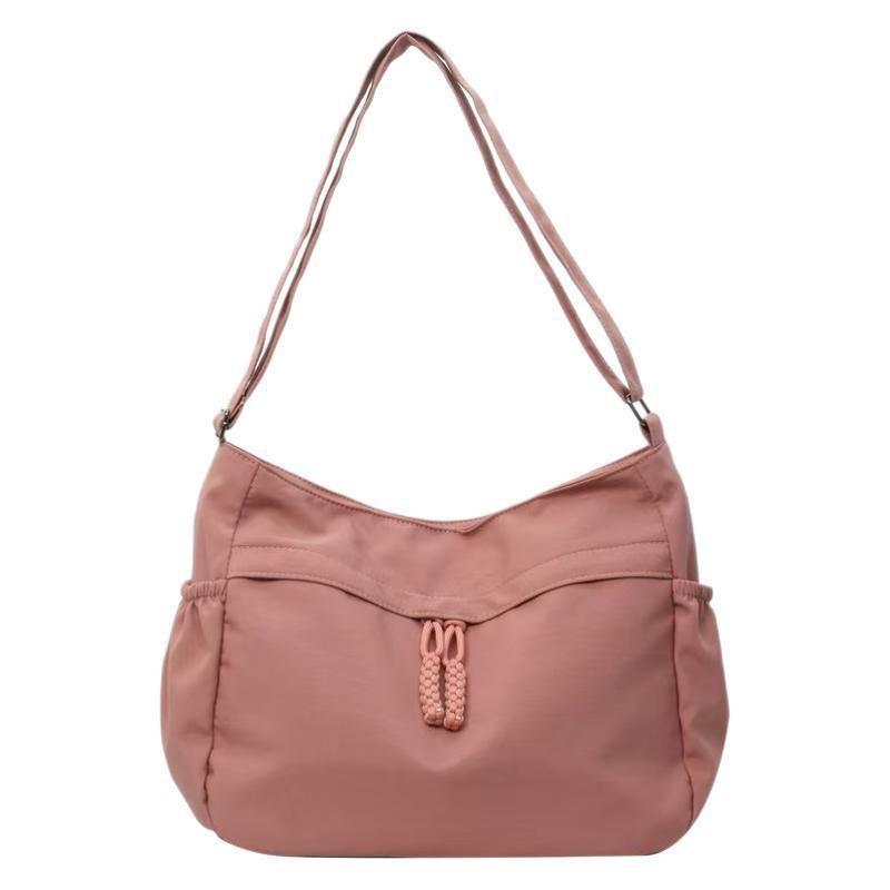 

Simple and large-capacity tote bag Casual versatile canvas bag Female commuter shoulder college student class messenger bag рожевий