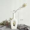 White Ceramic Vase with Dried Baby's Breath for Living Room or Dining Table Decoration