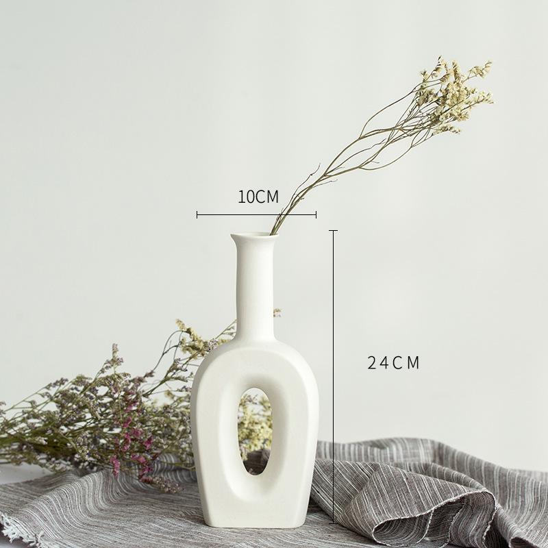 White Ceramic Vase with Dried Baby's Breath for Living Room or Dining Table Decoration