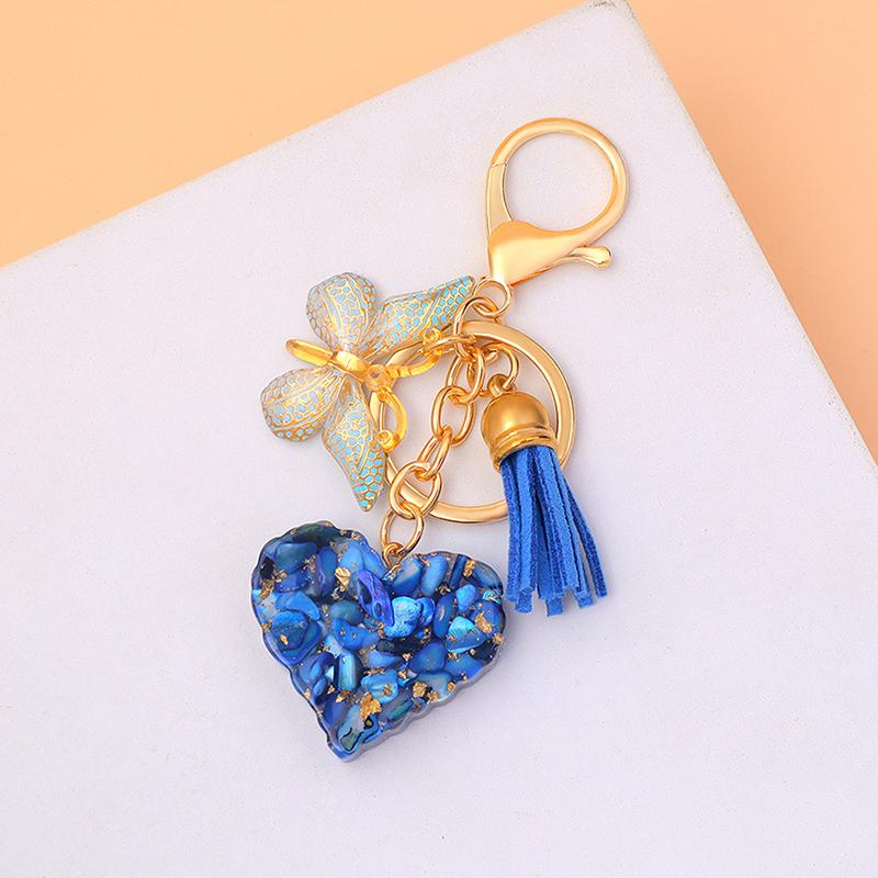 

Изысканные брелоки с подвесками в виде сердечек с кисточкой-бабочкой, блестящие брелоки из смолы, наполненные пайетками, женские украшения для сумки, автомобильный сувенир, подарки