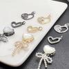 High Color Retention Mother-of-Pearl Heart Pendant with Bow and Multi-Hole Design for DIY Magic Box Accessories.