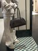 2026 Premium Cowhide Row Series Bowling Handbag, Large Capacity Commuting Shoulder Bag