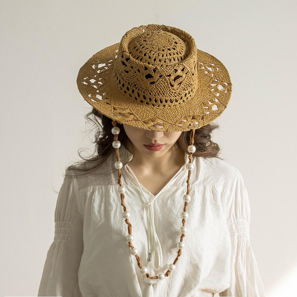 Designer Elegant Light Luxury Straw Hat Women Knitted Hanging Chain Pearl Hand Woven Hollow Beach Hat Fashion Wide Brim Sun Hats
