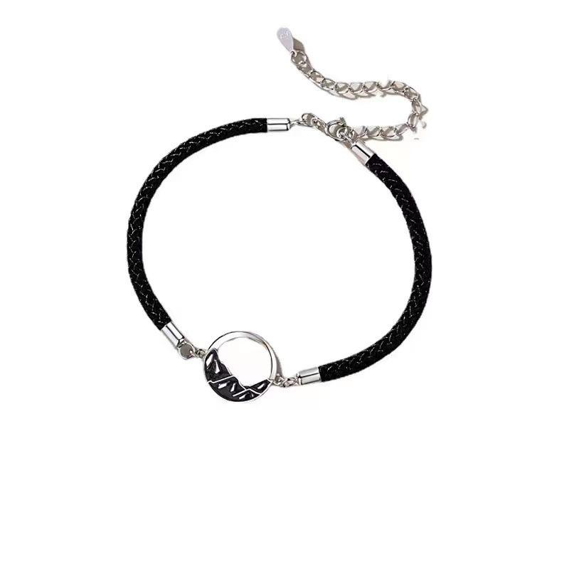 A stylish woven moon pendant bracelet, a couple's jewelry piece suitable for everyday wear by couples.
