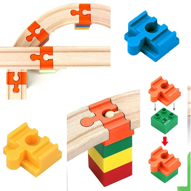 

Новые деревянные железнодорожные пути аксессуары пластиковые строительные блоки универсальный соединительный адаптер подходит для всех деревянных железнодорожных путей игрушки