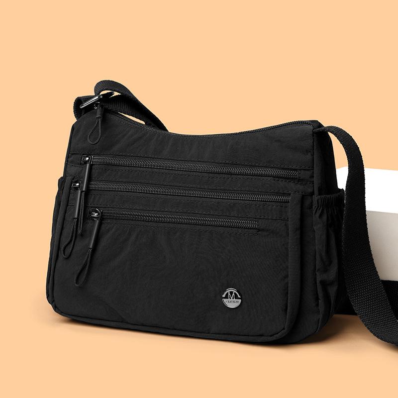 Dameskulderveske med stor kapasitet og lett vekt