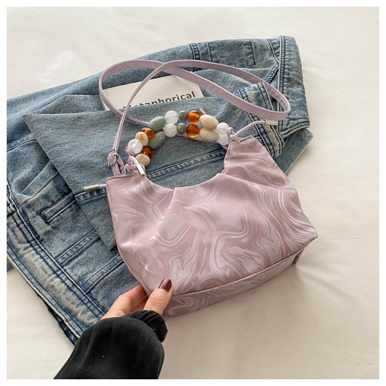 

2025 new temperament fashion design single shoulder crossbody foreign style solid color retro fresh bead texture crossbody bag bag розовый