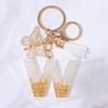 Chic White Tassel Letter Keychain with Resin Epoxy Pendant - Stylish Ornament for Bags