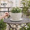 Unzerbrechlicher Blumentopf Teetasse Pflanzgefäß, Eleganter Blumentopf mit floralem Scherenschnittmuster, Dekoratives kleines Pflanzgefäß für den Innen- und Außenbereich Hausgarten