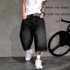 Męskie luźne czarne jeansowe spodnie capri z przetarciami 2026 Casual Streetwear Prosta nogawka