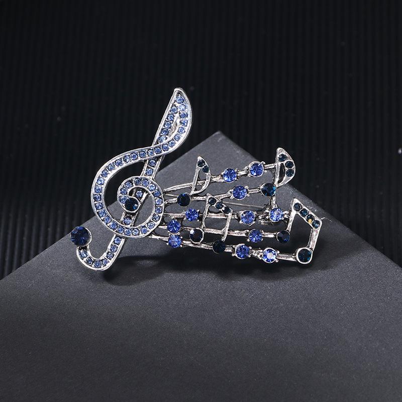 Spring and summer new alloy diamond music symbol brooch femininity high sense fashion music note clothing corsage