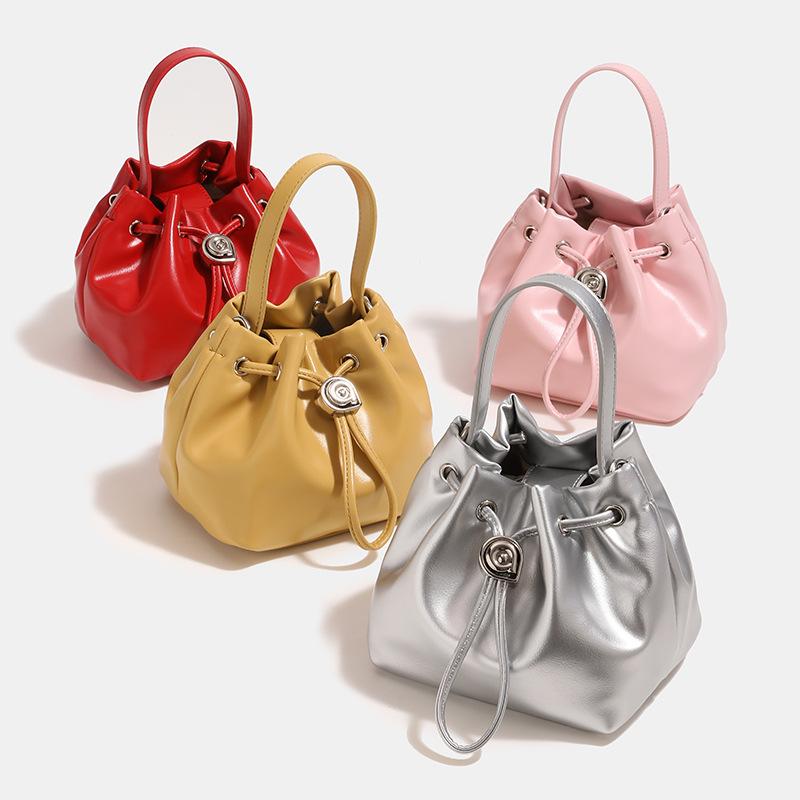 2024 Summer New Niche High-End Handheld Bucket Bag, Fashionable and Versatile Silver Drawstring Shoulder and Crossbody Bag for Women