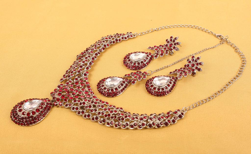 Touchstone Indian Bollywood Traditionally Marked White and Red Rhinestone Alluring Bridal Designer Jewelry Necklace Set In Silver Tones for Women.