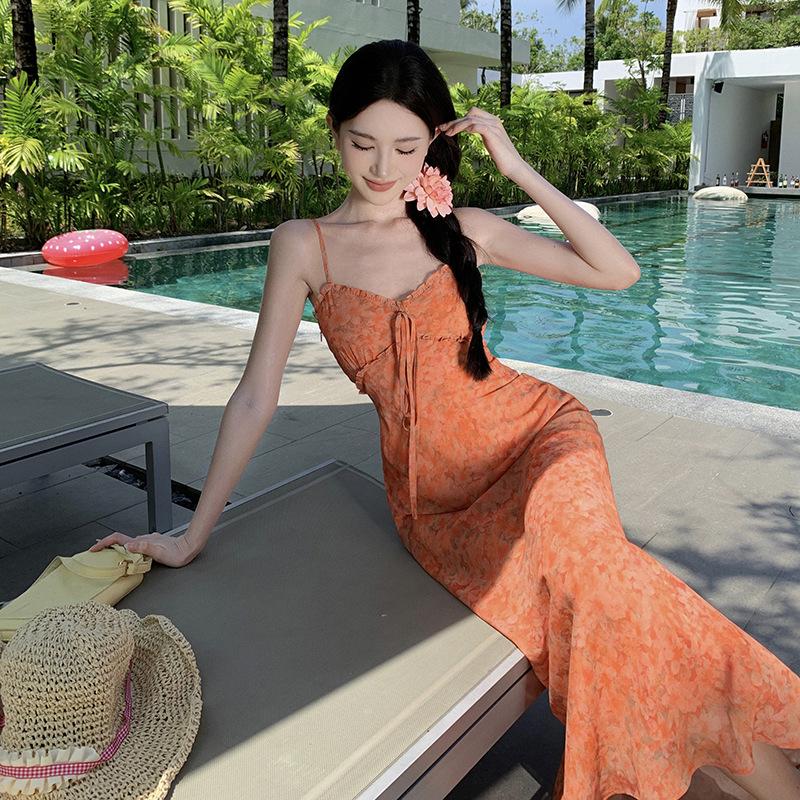 The Real Shot of the New Floral Vacation Dress Closes the Waist and Shows White and Orange Suspender Skirt.