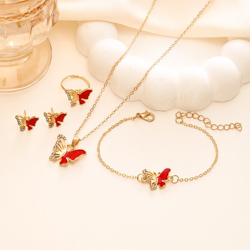Elegancki Zestaw Biżuterii Motylkowej: Naszyjnik, Bransoletka, Pierścionek, Kolczyki