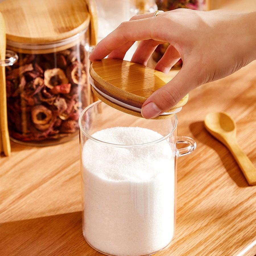 Round Glass Storage Jar with Spoon - High Borosilicate, Multi-purpose Transparent Sealed Container for Tea, Grains, or Flowers