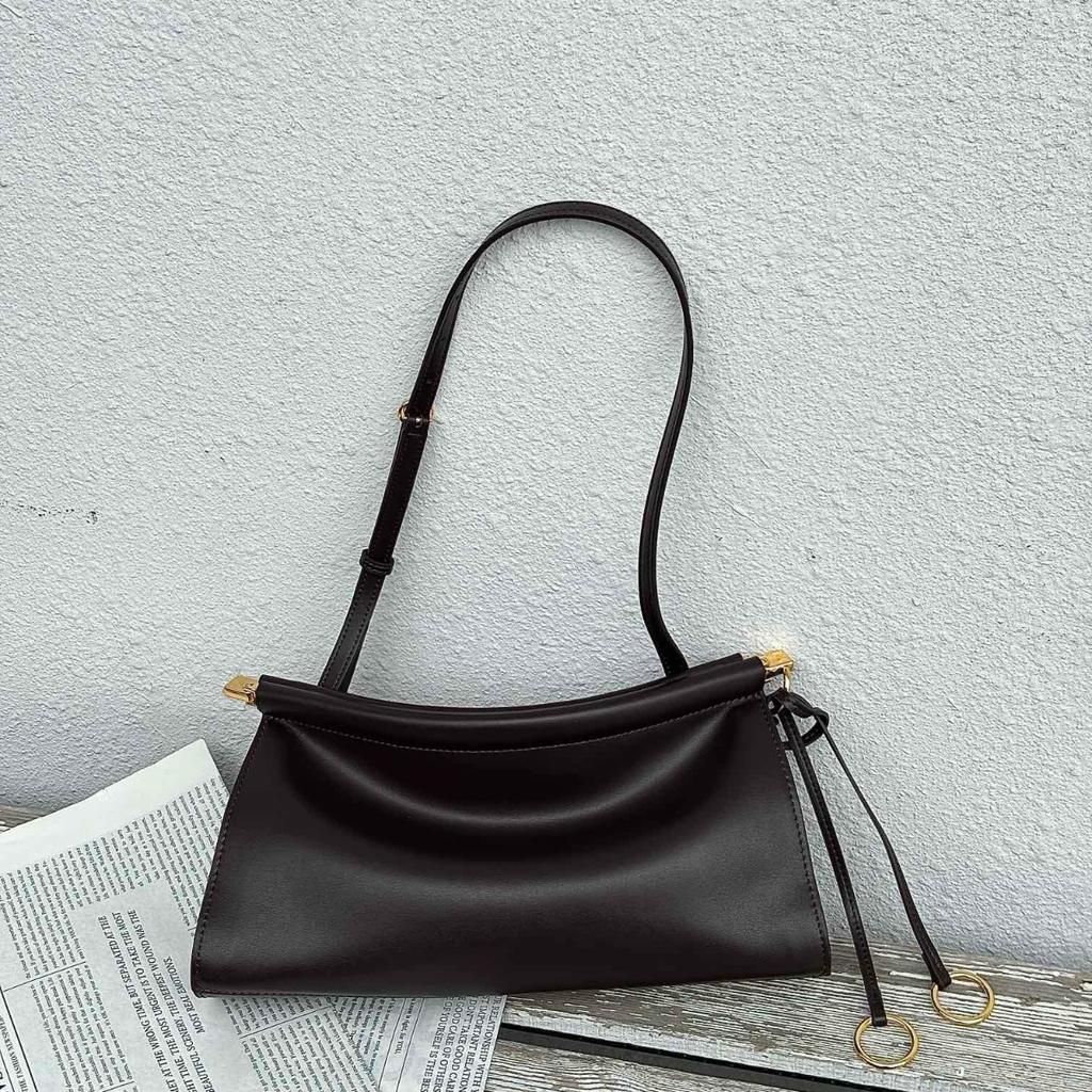 2025 neue Sommer- und Herbst-Clip-Tasche Französische Nischen-Leder-Schulter-Unterarmtasche Leder Retro-Mode Baguette-Tasche Damen
