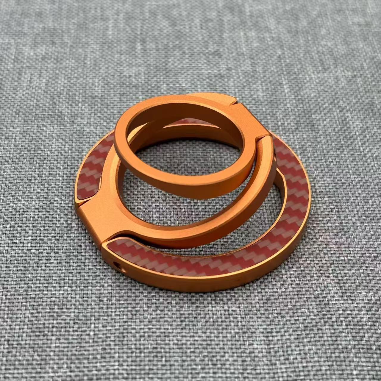 

Double Ring MagSafe Phone Holder: Strong Magnetic Grip, Finger Ring, Kevlar Fiber, Multifunctional Folding Design.