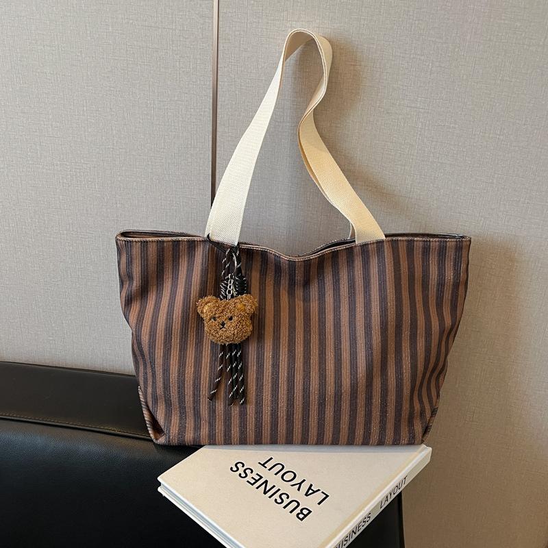 

Сумка большой вместимости женская 2025 новая модная сумка-тоут для通勤 женская ins маленькая свежая класс студенческая сумка-тоут no pendant темно-коричневого