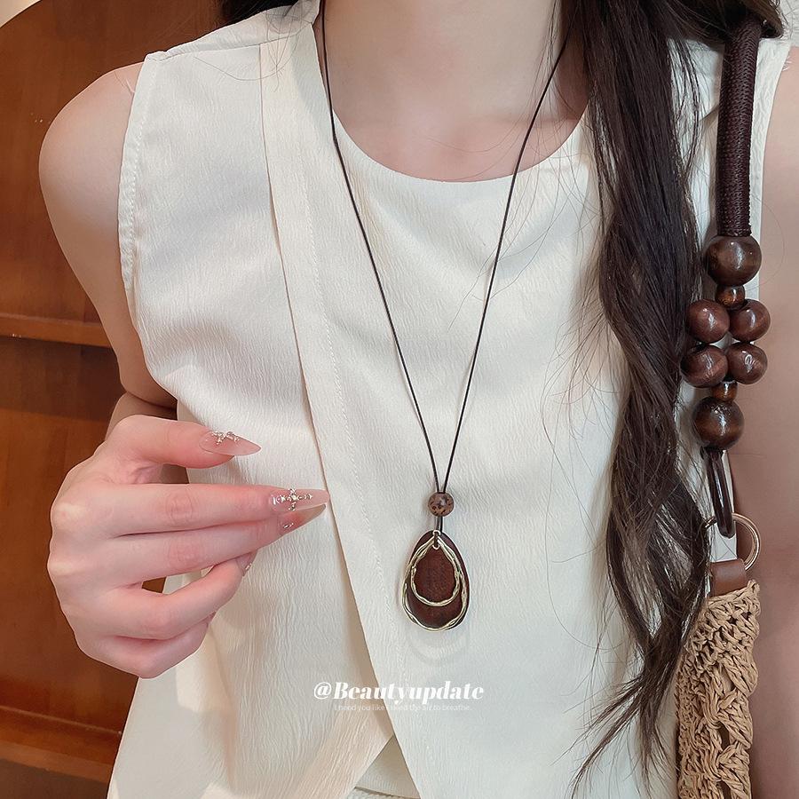 Retro Ethnic Leather Rope Necklace with Wooden Heart, Leaf, and Geometric Water Drop - High-Grade Sweater Chain