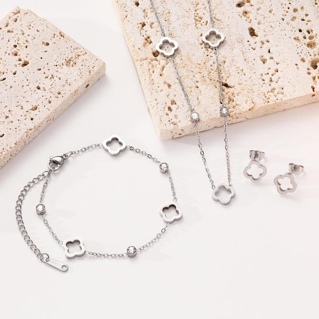 18K Gold Four-Leaf Clover Jewelry Set: Necklace, Bracelet, and Earrings in Titanium Steel with Zirconia.