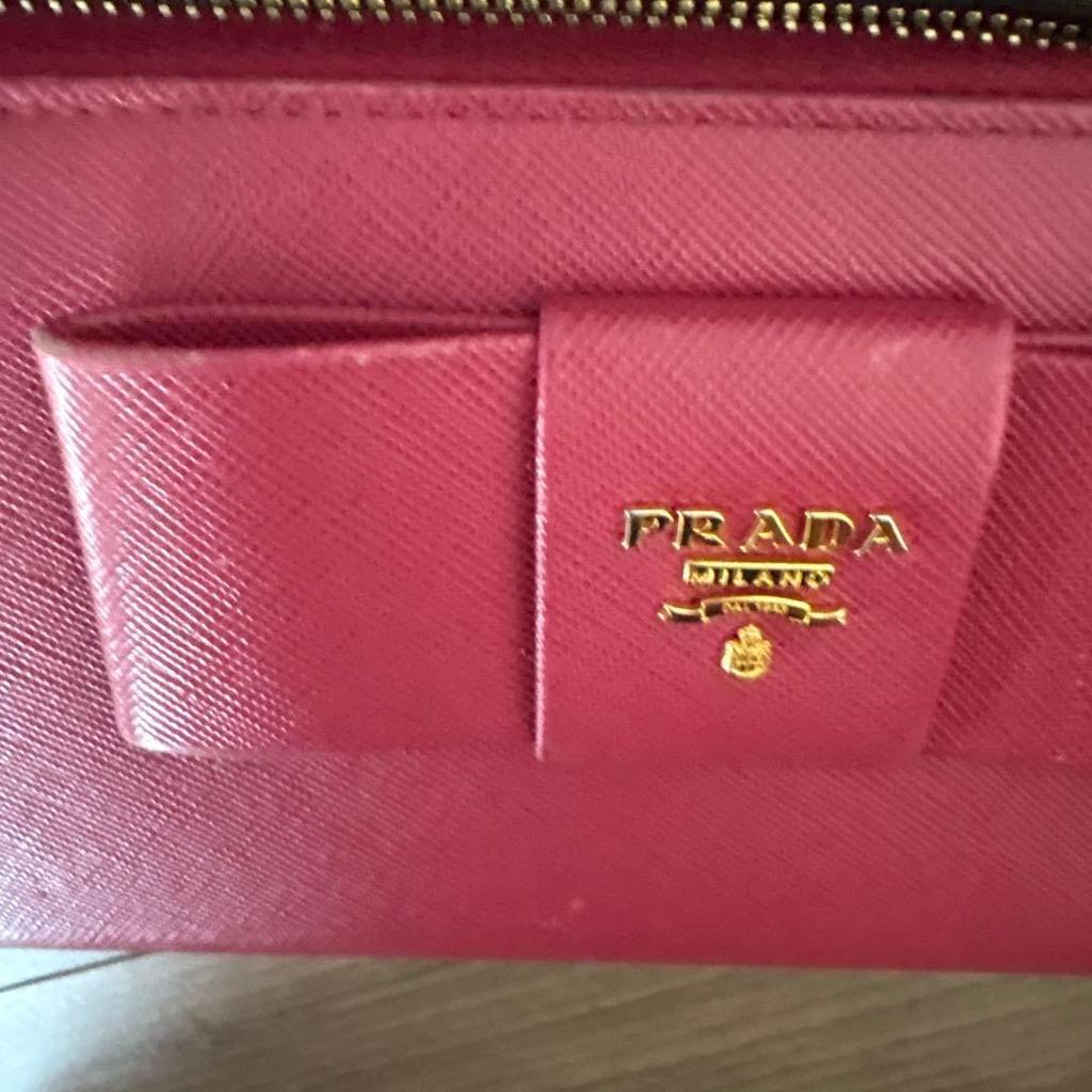 Used PRADA long wallet ribbon round zipper