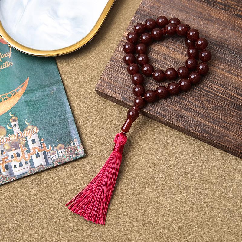 Handgefertigtes grenzüberschreitendes 33-Perlen-Quastenarmband - Gebetsperlen aus Korallimitat