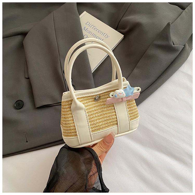 

2025 summer new bag women s fashion versatile Korean version woven bucket bag vacation portable shoulder messenger bag