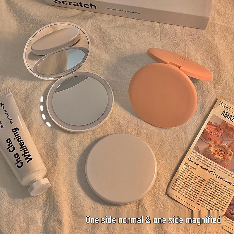 Portable LED Light Makeup Mirror - Compact, Handheld, Foldable, Round Mirror with Touch Light for Carry.