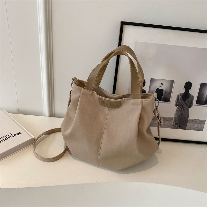 Casual canvas bag women's new versatile simple shoulder handbag fashionable large-capacity student class shoulder bag