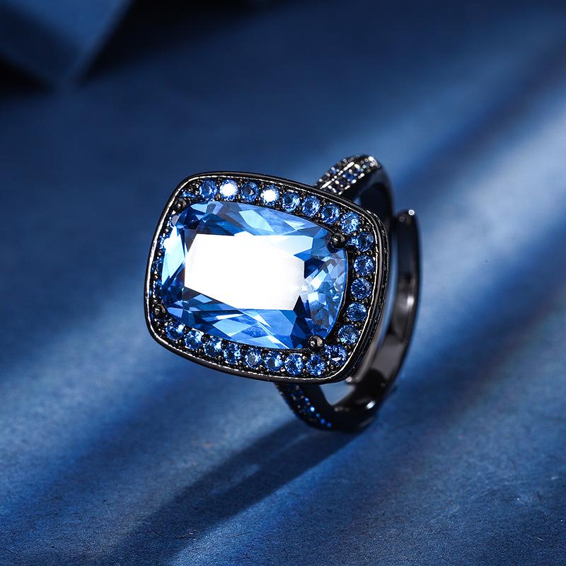 

Ювелирные изделия Медное основание Позолоченное Имитация Красного Корунда Синий Шпинель Темперамент Полный Квадрат Черное Золото Костюм Женский 10 * 14