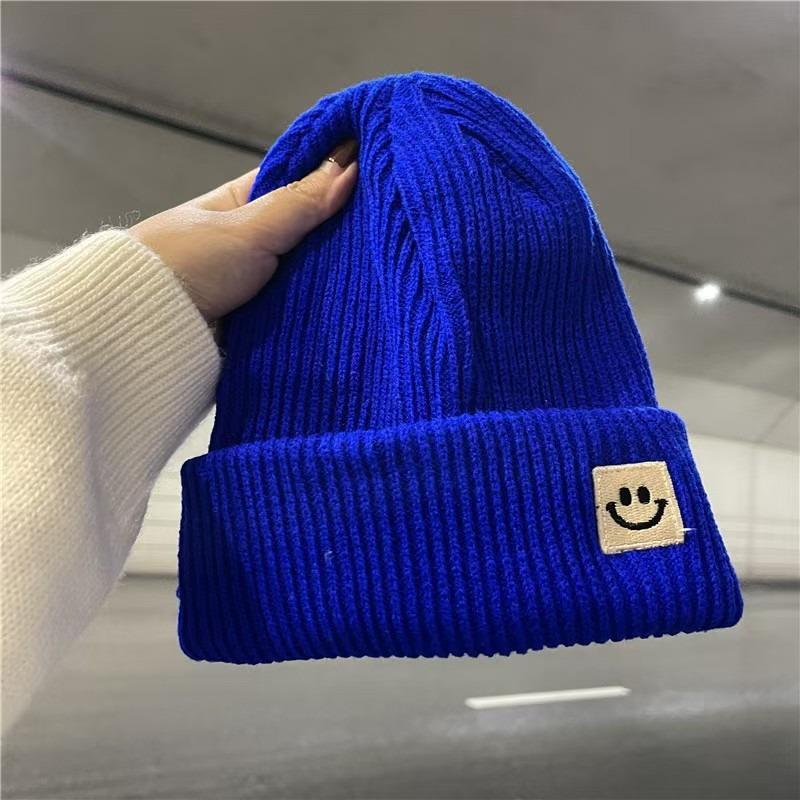 Devil smiley face label wool hat women's autumn and winter warm trend versatile ear protector black knitted hat