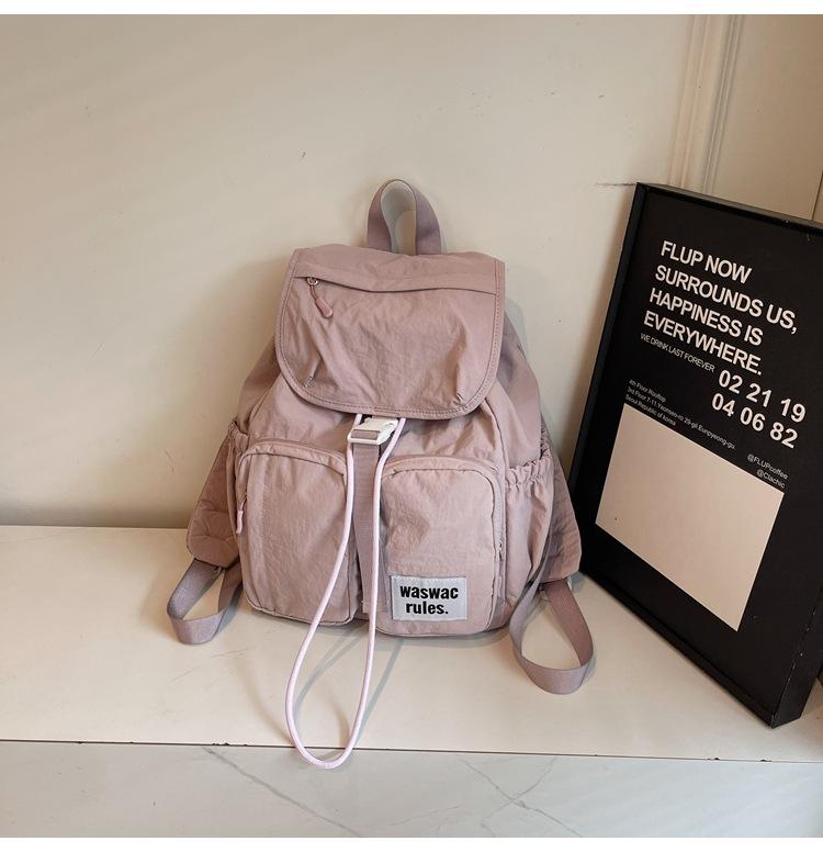 

Рюкзак для студента колледжа 2025 новый повседневный рюкзак для средней школы модный универсальный японский школьный рюкзак большой вместимости для занятий фиолетовый