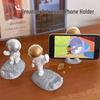 Spaceman Phone Holder: Creative Astronaut Figurine for Desktop Décor & DIY Ornament.