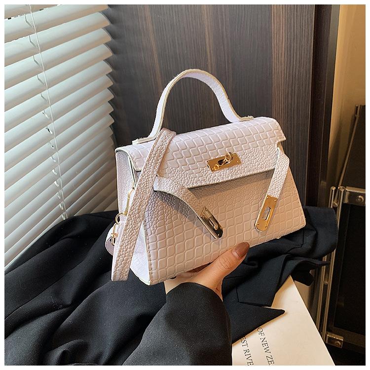 

Новий суцільний кольоровий візерунок з каменем 2024 замок літо відчуття осені особистість іноземний стиль дизайн жіноча портативна маленька квадратна сумка через плече білий