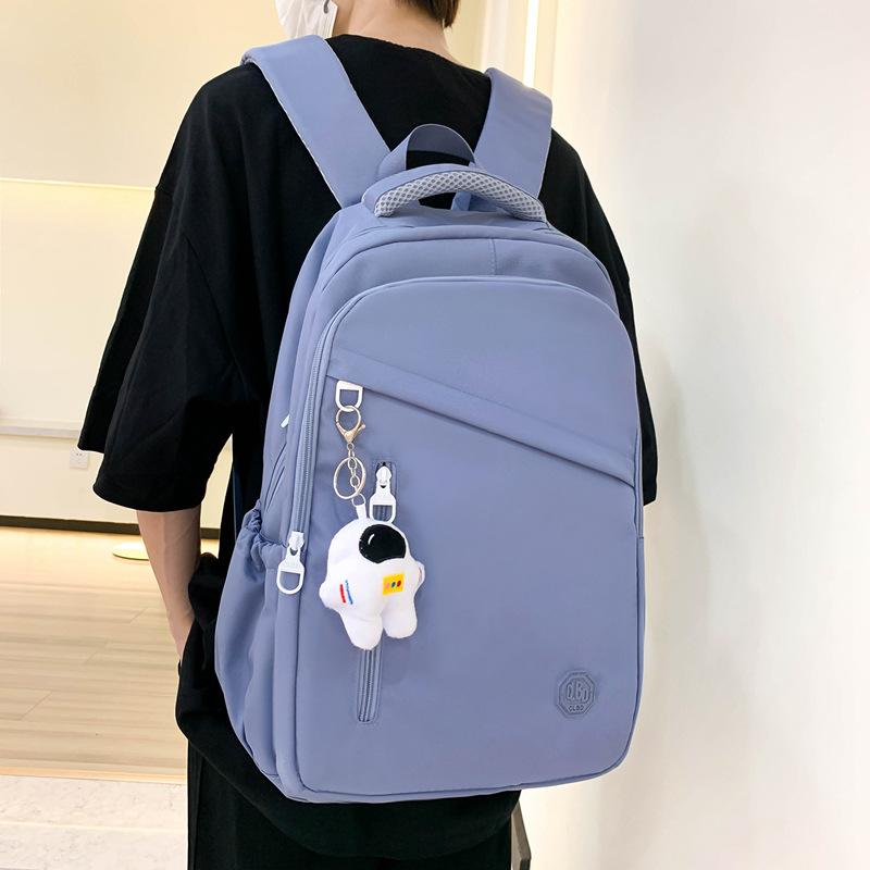 New student schoolbag, girls' large-capacity weight reduction, light solid color simple junior high school backpack