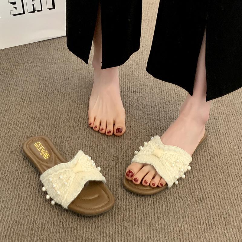 French small fragrant pearl slippers women's summer wear 2025 new fashion and leisure one-word flat-bottomed beach cool slippers