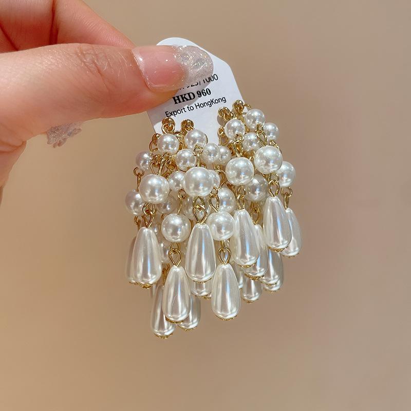 

Silver needle water drop pearl fringed earrings niche temperament cold wind earrings French light luxury high-end earrings