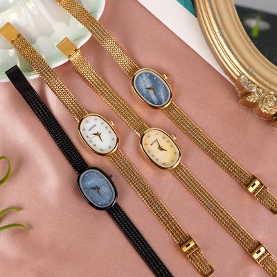 Ocelový řemínek Quartz hodinky Dámské hodinky Niche Lehký luxus Špičkové Quartz hodinky Dámské Oválný ciferník osazený diamanty